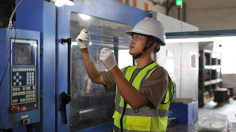 The production workers at JingHui Factory are manufacturing license plate frames